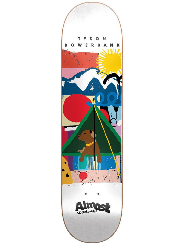 Almost Bowerbank Indy R7 8.25 White skateboard deck: A colourful painterly camping scene on a white deck: a green tent with a brown dog sitting inside, a sun, blue mountains and bold abstract blocks of red, pink and yellow with black splatter.