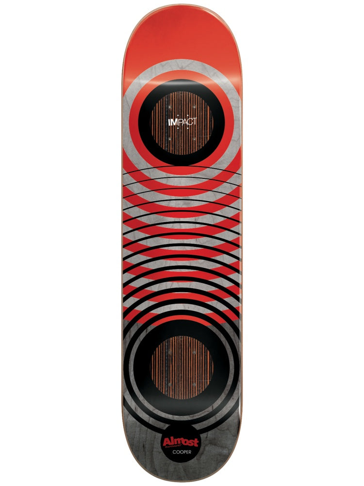 Almost Cooper Red Rings Impact 8.0 skateboard deck: Red and grey deck with concentric black rings around two circles of exposed wood at the bolt areas, and horizontal curved lines between. Red Almost logo and 'Cooper' near the tail.