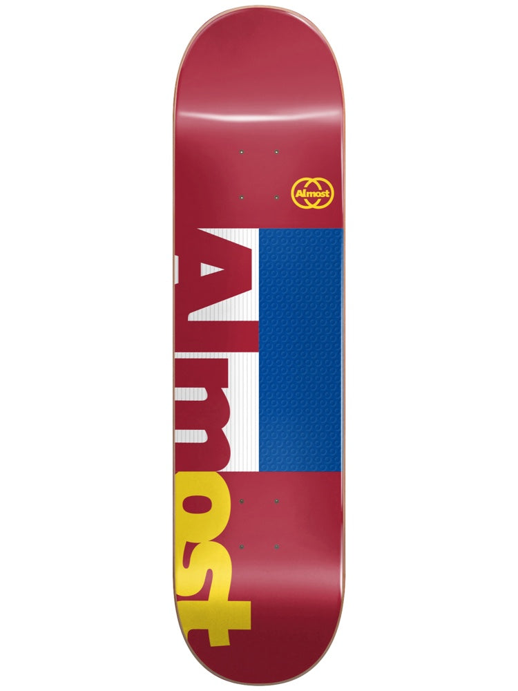 Almost Dilo Ivy League Impact Light 8.5 skateboard deck: Bold Almost wordmark split into stacked letters in white and yellow on a burgundy deck, with a blue textured rectangle beside it and a small yellow circular logo near the top.