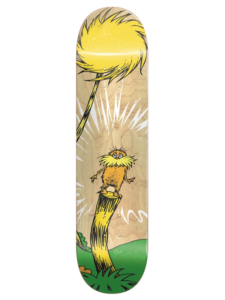 Almost Dr.Seuss Youth Logo R7 skateboard deck: Dr. Seuss's Lorax standing on a tree stump beneath a yellow tufted Truffula tree, with white burst lines, on a natural wood deck with a green grassy base.