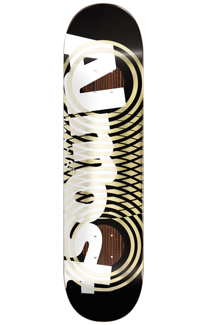 Almost Interweave Rings Impact YOUNESS 8.25 skateboard deck: Large white Almost logo running vertically over concentric cream and gold rings that overlap in a moiré-style interweave. Black background with rings revealing wood-grain circles at both ends.
