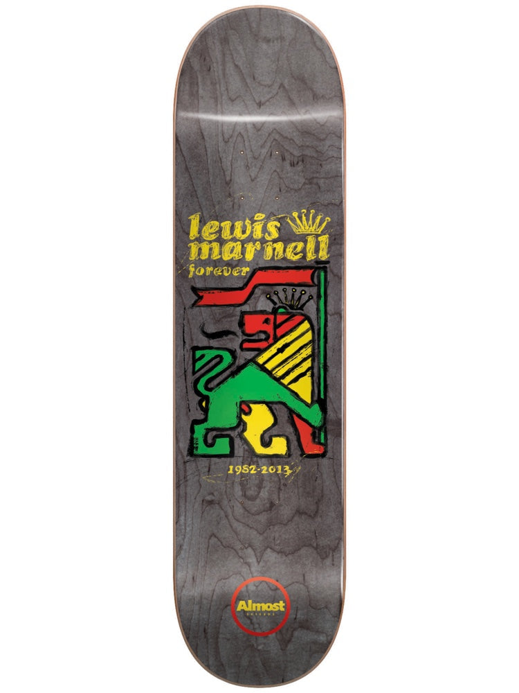 Almost Lewis Rasta Lion R7 8.0 skateboard deck: Rasta-coloured red, yellow and green lion holding a flag, drawn in a rough woodcut style on a grey deck. Lewis Marnell Forever with a gold crown above and the dates 1952-2013 below.