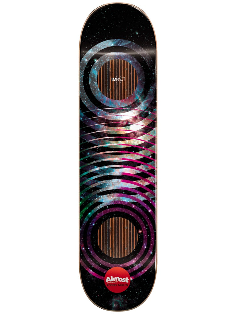 Almost Mullen Space Rings Impact 8.25 skateboard deck: Concentric rings and overlapping bands filled with a pink and teal galaxy image on a black starfield, with two woodgrain-striped circles and a red Almost dot logo at the bottom. Impact label near the top.