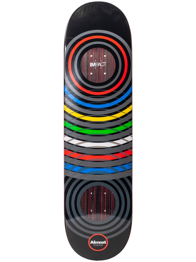 Almost Ring Games Youness 8.25 Impact Light skateboard deck: Concentric grey rings on black, with a red ring at the top and rainbow-coloured ring arcs down the length, like Olympic rings. Red wood-grain circles show through, with an IMPACT logo at the top and Almost Youness at the foot.