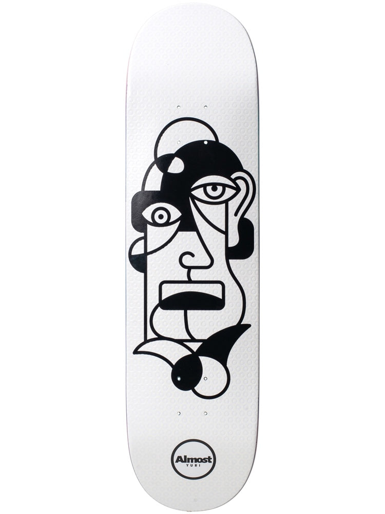 Almost Twisted Yuri R7 skateboard deck: Abstract black line-drawn face in a cubist style, with mismatched eyes, a rectangular mouth and curling shapes at the chin, on a white deck. Round Almost Yuri logo at the tail.