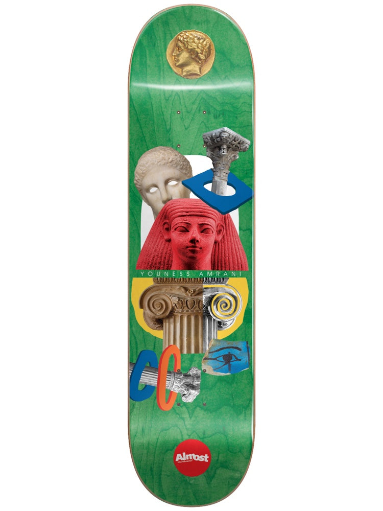 Almost Youness Relics R7 Green 8.0 skateboard deck: Green deck with a collage of ancient relics: a gold coin, a marble head, a red Egyptian head, Greek columns, an eye of Horus tile and blue geometric shapes. Rider name on a green band, with Almost logo at the tail.