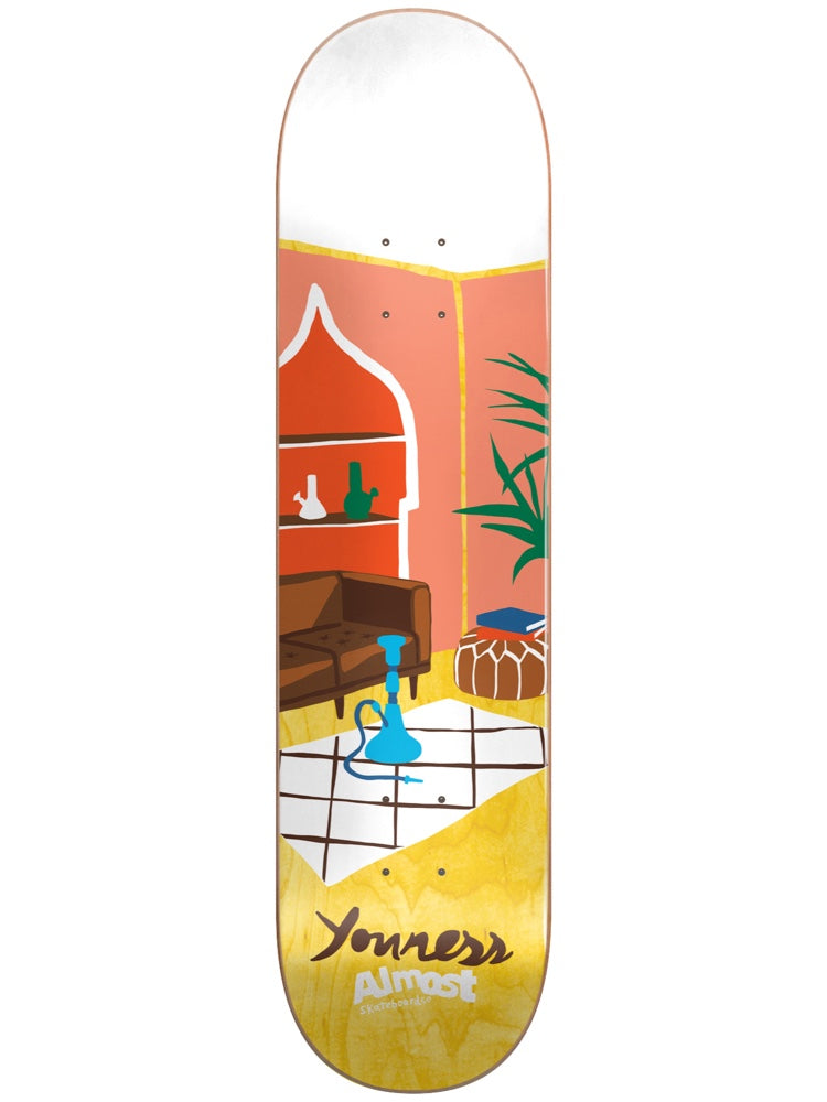 Almost Youness Rooms Super Sap R7 8.0 & 8.25 skateboard deck: A flat illustration of a living room with a brown leather sofa, a blue hookah on a tiled rug, a potted plant, a pouffe with books and an arched shelf holding bongs. Youness and Almost are signed at the tail.