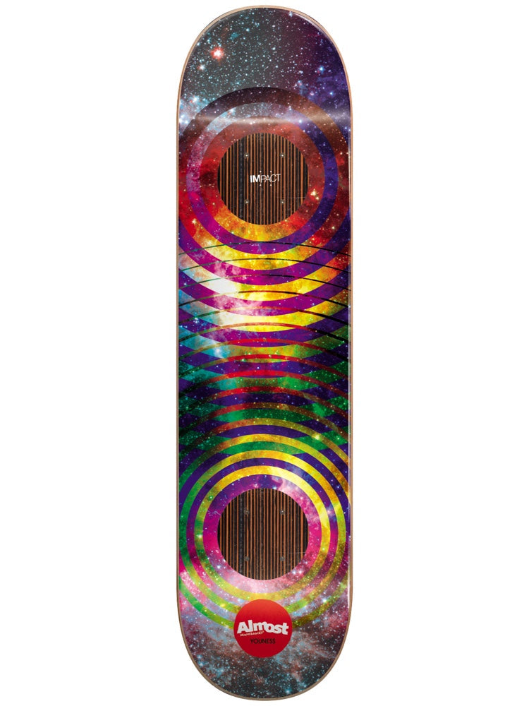 Almost Youness Space Rings Impact 8.375 skateboard deck: Colourful nebula and starfield background with two sets of concentric rings overlapping at the centre, each with a dark striped core. A small Impact label and Almost logo appear at the top and bottom.