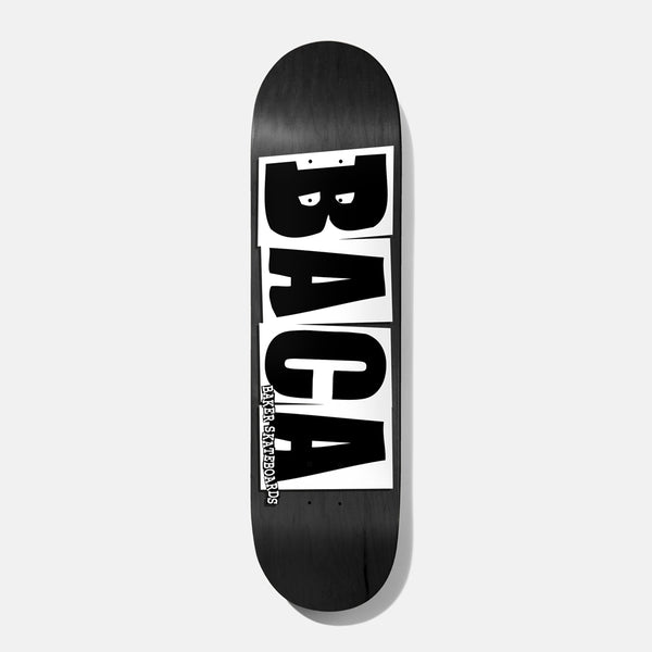 Baker Baca Logo Grey 8.0 skateboard deck: Rider name BACA in huge black block capitals on white cut-out panels, with small 'Baker Skateboards' text up the side, on a black wood-grain deck.