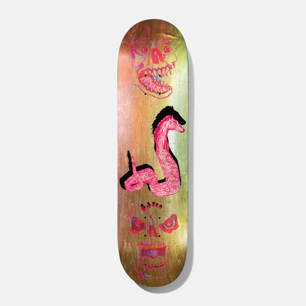 Baker Casper Fade Heads 8.25 skateboard deck: Natural wood deck with an iridescent green and copper foil sheen, showing a pink furry snake-like creature with a black mane and two pink screaming skull faces at either end. Small Baker lettering.