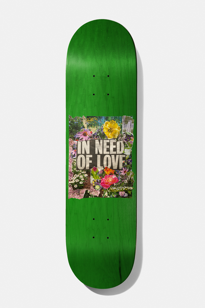 Baker Casper Brooker In Need Of Love 8.25 skateboard deck: Green stained deck with a square torn-paper collage of garden flowers and the words In Need of Love across the middle.