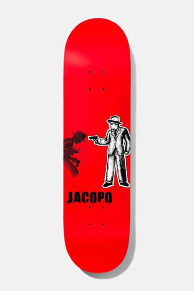 Baker Jacopo Take the Cannoli 8.125 skateboard deck: Illustrated man in a suit and fedora aiming a pistol, with a stippled black shadow figure beside him, on a flat red deck. Jacopo in black capitals below.