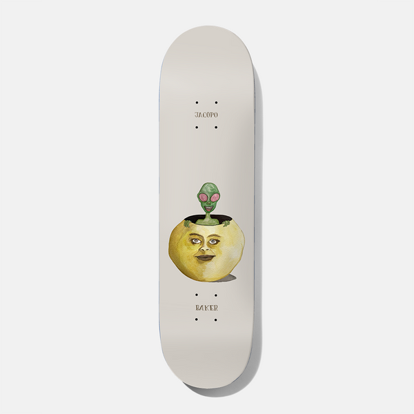 Baker Jacopo Waters 8.38 skateboard deck: Painted green alien with pink eyes peeking out of a hole in a yellow face-shaped gourd, on a plain off-white deck. Small 'Jacopo' and 'Baker' text near each end.