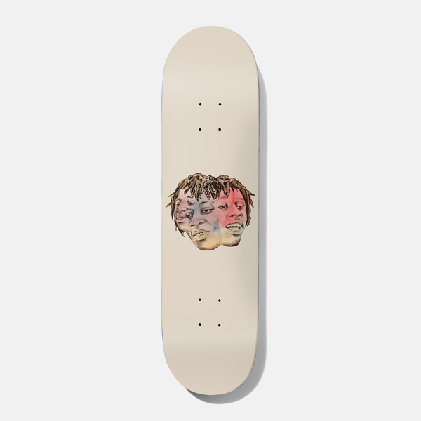 Baker Kader Head Case 8.0 skateboard deck: A small drawn portrait of a man with dreadlocks, shown as three overlapping faces tinted with soft red, blue and yellow washes, centred on a plain cream deck.