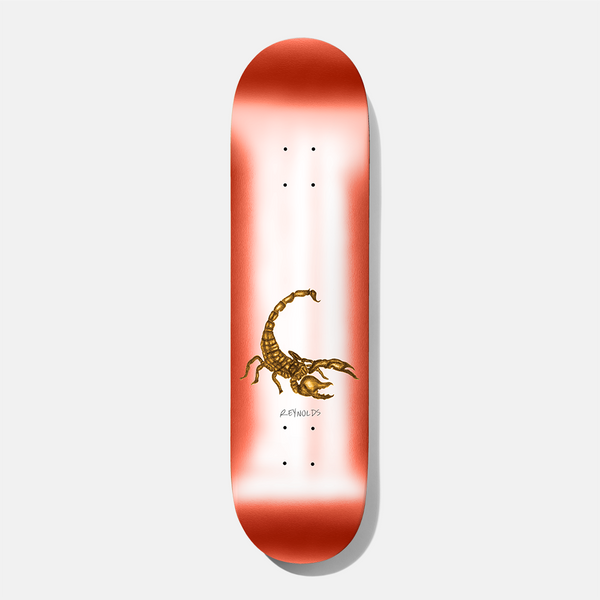 Baker Reynolds Eraser Head 8.475 skateboard deck: Airbrushed deck fading from red edges to white, with a detailed golden scorpion in the centre and a small signature-style name beneath it.