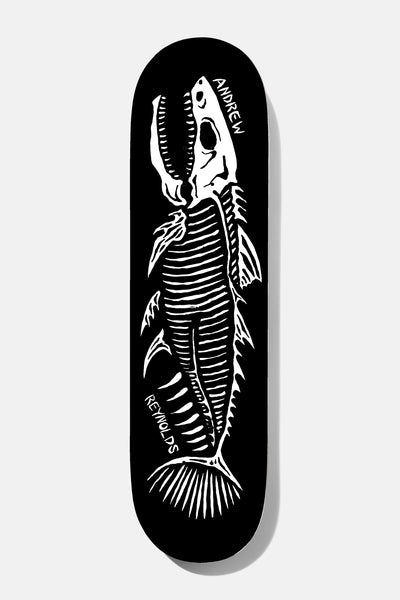 Baker Reynolds Fish Sticks 8.25 skateboard deck: White hand-drawn skeleton of a fish with open jaws, ribs and fins on a black deck, with Andrew Reynolds written in white beside it.