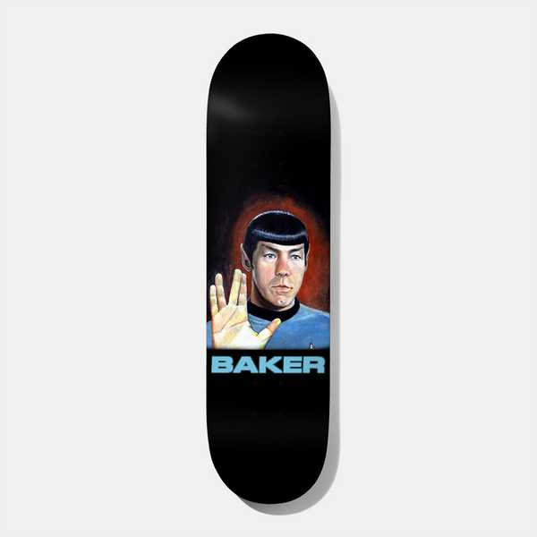 Baker Reynolds Vulcandrew 8.25 skateboard deck: Black deck with a painted portrait of a pointy-eared, bowl-cut figure in a blue sci-fi uniform raising a hand in a split-fingered Vulcan salute against a red glow. Brand name in pale blue capitals below.