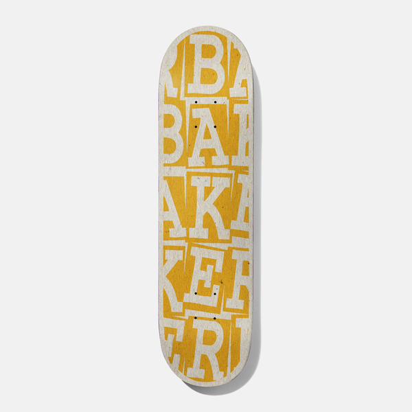 Baker Riley Ribbon Stack 8.25 B2 skateboard deck: Brand name repeated in stacked, overlapping cut-out serif letters in cream across the whole deck, over an amber yellow background.