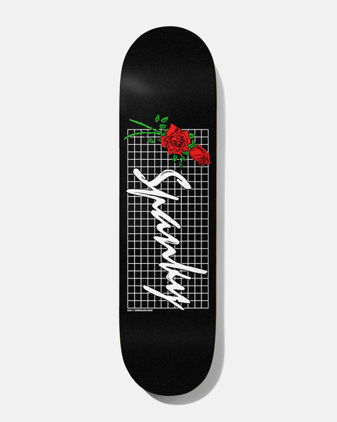 Baker Spanky Roses Black 8.25 skateboard deck: The rider's name in white brushed script over a white grid on a black deck, with a spray of red roses with green stems across the top corner.