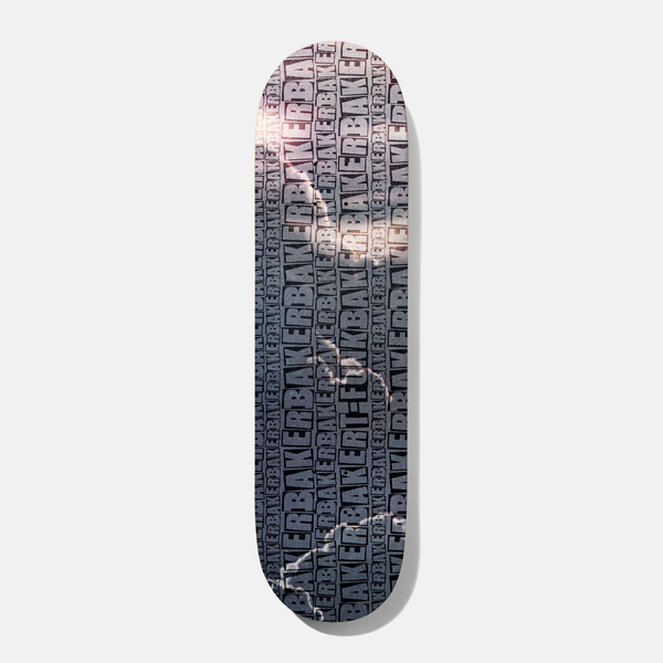 Baker T Funk Repeat Grey B2 8.5 skateboard deck: Grey deck covered in a repeating pattern of the Baker box logo, with a faint lightning-like crackle and a pinkish glare across it. T-Funk name appears in the pattern.