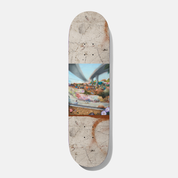 Baker Tfunk Wasteland Paradise 8.25 skateboard deck: A painted scene of a graffiti-covered concrete skate bowl beneath freeway overpasses, with flowers in the foreground, set as a central band across a weathered concrete-textured deck with rust-orange spray marks.