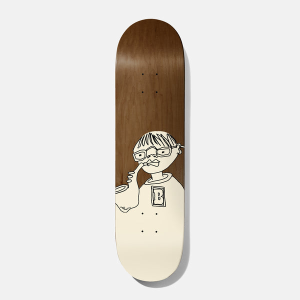 Baker Theotis Toots 8.25 skateboard deck: Cream line drawing of a bespectacled boy in a B-lettered top picking his nose, on a brown wood-stained deck, with the lower part of the deck filled cream.