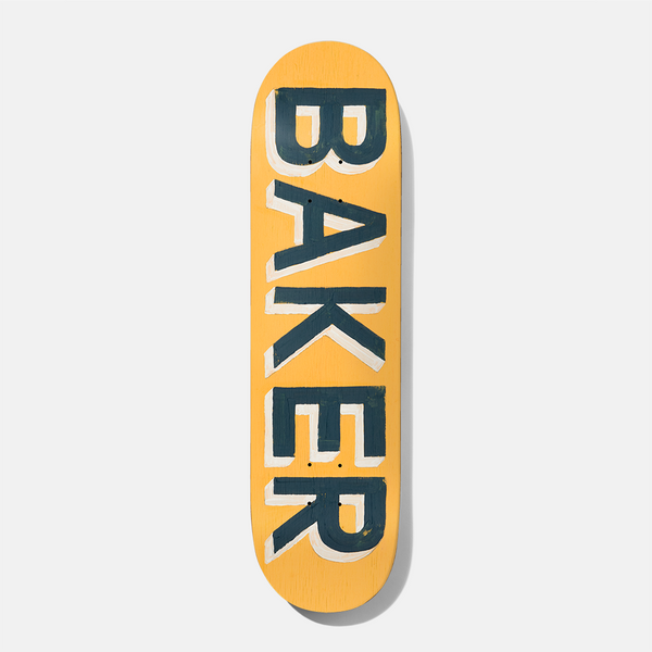 Baker Tyson Painted 8.5 skateboard deck: The word BAKER in large hand-painted dark teal capitals with a cream drop shadow, running vertically down a mustard yellow deck.