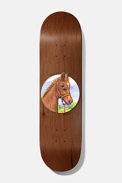 Baker Tyson Seasons B2 8.5 skateboard deck: A painted portrait of a brown foal in a rope halter inside a circle with sky and grass behind, on a brown wood-grain deck, with 'Tyson' and 'Baker' handwritten around the edge.