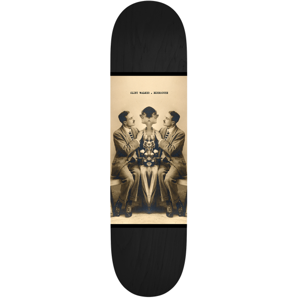 Birdhouse Clint Walker Beautiful Mutants 8.25 skateboard deck: A sepia vintage photograph panel in the centre of a black deck shows two seated men in suits flanking a woman, mirrored and merged so her head is replaced with a symmetrical floral form. A small caption names the rider and brand.