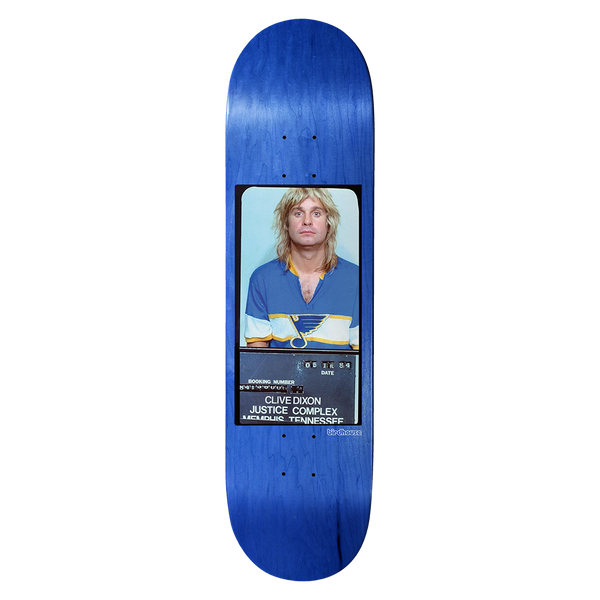 Birdhouse Clive Dixon Mugshot 8.5 skateboard deck: Photographic mugshot of a long-haired blond man in a blue and white hockey-style jersey, with a booking board reading Memphis, Tennessee, set on a blue-stained deck. Small Birdhouse logo beside it.