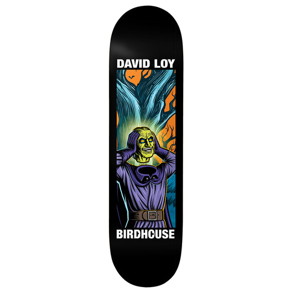 Birdhouse David Loy Second Life 8.5 skateboard deck: A green-faced ghoulish figure in a purple robe and belt clutches its head and grins, in front of twisted blue trees and orange leaves, framed in a rectangle on a black deck with white name and brand text.