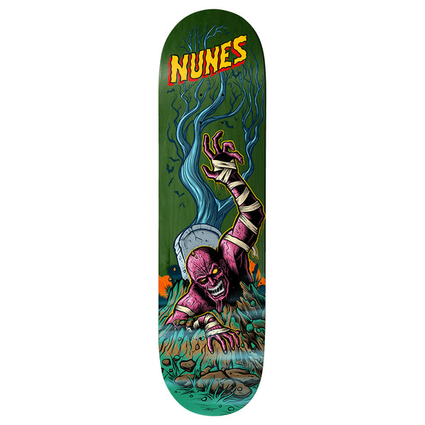 Birdhouse Felipe Nunes Graveyard 8.25 skateboard deck: A purple bandaged mummy-like zombie claws its way out of a grave, one arm raised, beside a headstone and a bare blue tree on a green deck. Yellow and red 'Nunes' lettering sits at the nose.