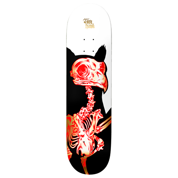 Birdhouse Hawk Golden Remains 8.25 skateboard deck: X-ray style red and gold skeleton of a hawk with a large beak and eye, set against a black silhouette of the bird on a white upper deck. Tony Hawk name in small gold gothic lettering at the top.
