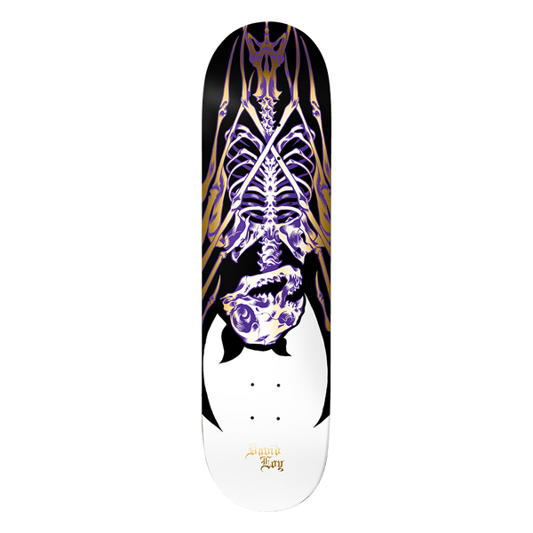Birdhouse Loy Golden Remains 8.475 skateboard deck: X-ray style purple and gold skeleton of a hanging bat with outstretched ribs and wings, above a white rounded area on a black deck. David Loy name in small gold gothic lettering.