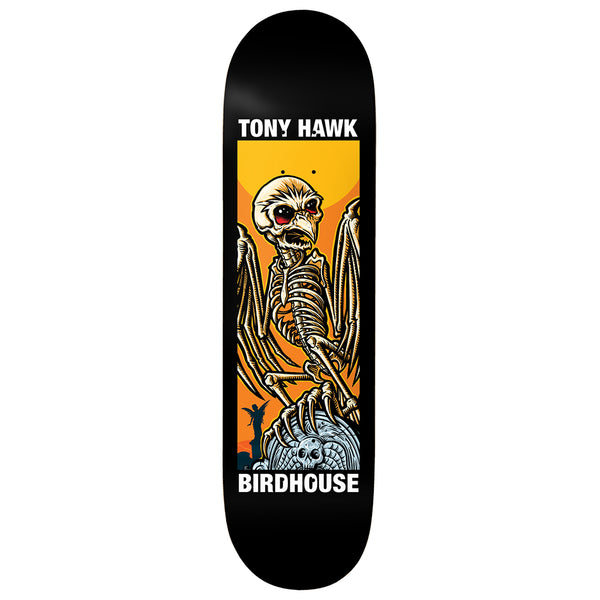 Birdhouse Tony Hawk Second Life 8.0 skateboard deck: A winged skeleton with a bird-like skull and red eyes perches on a skull-topped tombstone against an orange sunset, inside a rectangular panel on a black deck. Rider and brand names above and below.