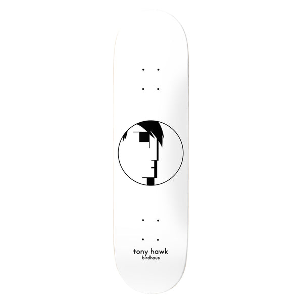 Birdhouse Tony Hawk Entries White 8.0 skateboard deck: A white deck with a black circle enclosing a minimalist, geometric profile face with a dark fringe of hair, in a Bauhaus-inspired style. Small lowercase name and brand text sits near the tail.