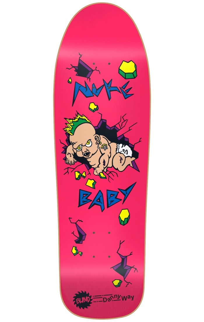 Blind Danny Way Nuke Baby SP PINK R7 9.7 skateboard deck: A cartoon mutant baby with a green mohawk and earrings bursts through a cracked wall, surrounded by yellow-green rubble. Jagged blue 'Nuke Baby' lettering is on a hot pink deck, with a Blind logo and Danny Way name at the tail.