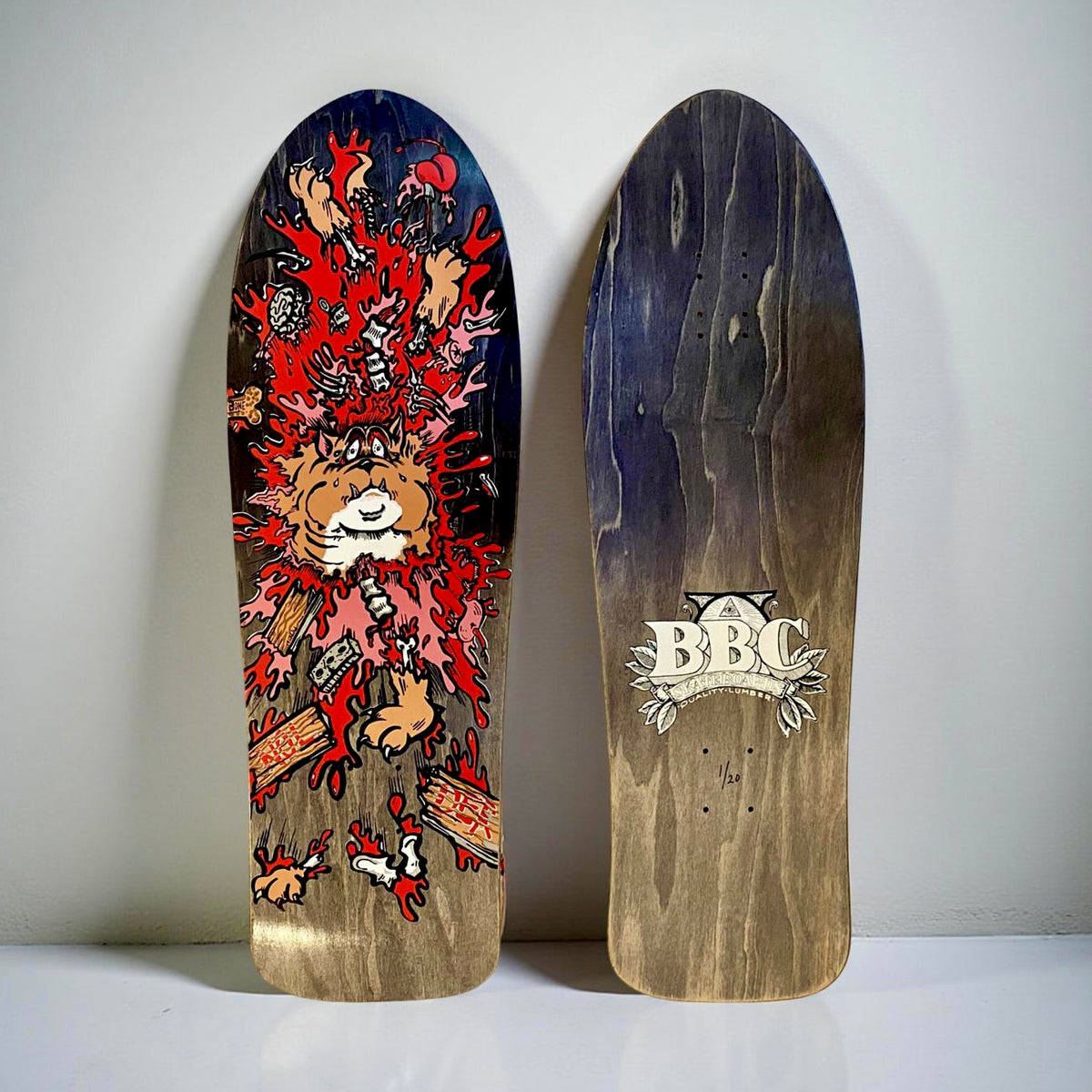 Brand-X Monty Nolder Exploded Bulldog (#3) skateboard deck: Cartoon bulldog bursting apart in a splatter of red blood, with limbs, bones, a heart and debris flying out, on a dark stained old-school shaped deck. The underside shows a BBC crest logo with a numbered edition mark.