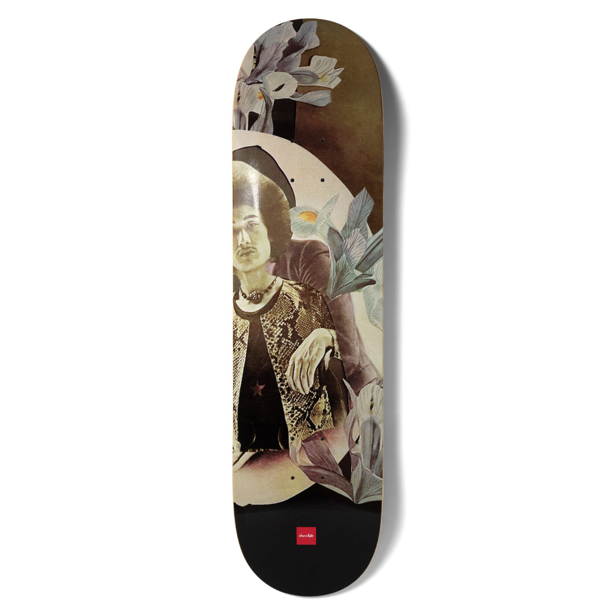 Chocolate Aikens Dru - Sign skateboard deck: Vintage-style photographic collage of a seated man with an afro in a snakeskin-print vest, framed by an oval and overlapped by pale blue irises. Black section at the base with the small red Chocolate logo.