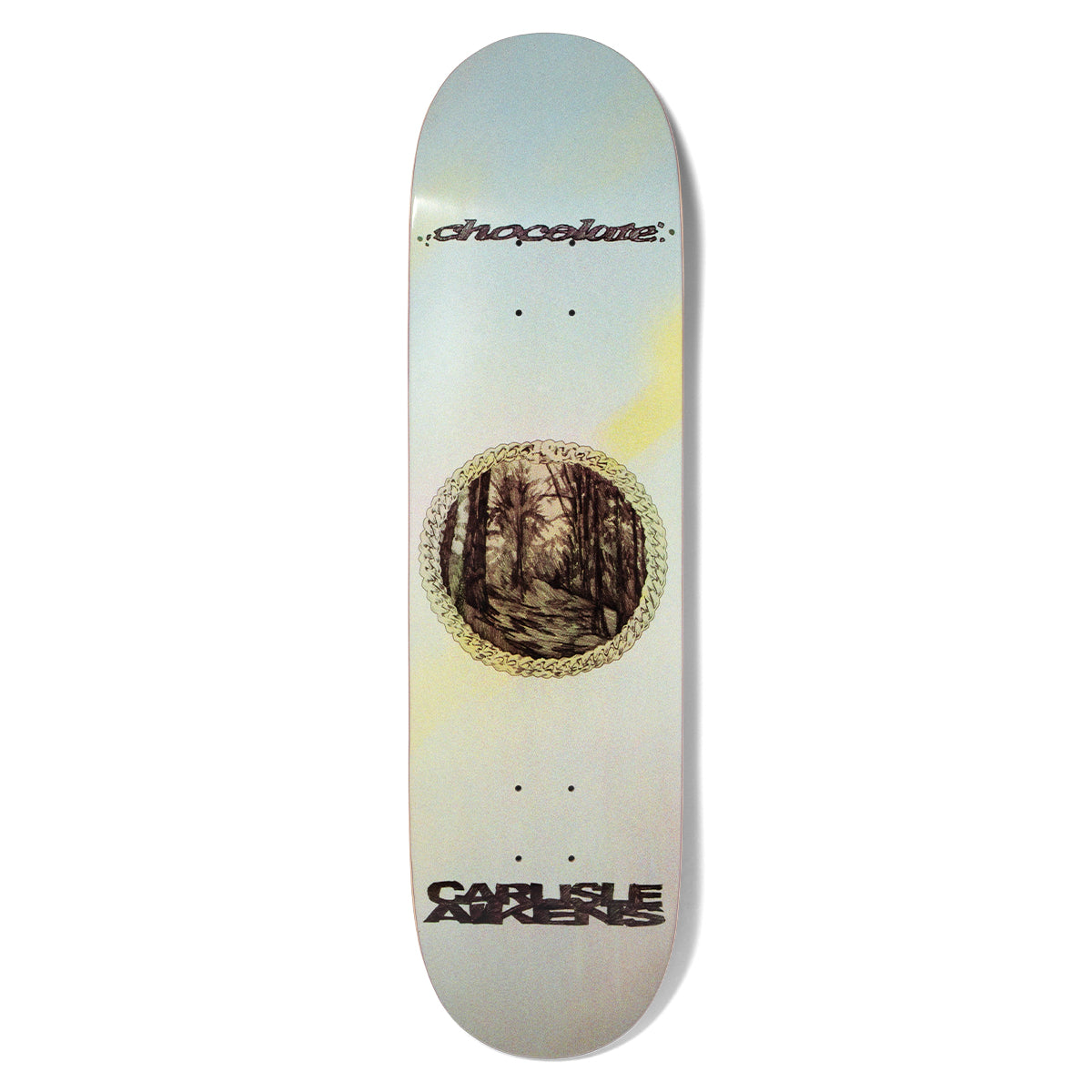 Chocolate Aikens Halcyon skateboard deck: Circular engraving-style woodland path scene inside a gold chain border, on a pale blue-grey deck with soft yellow glows. Chocolate script at the top and the rider's name in black at the bottom.