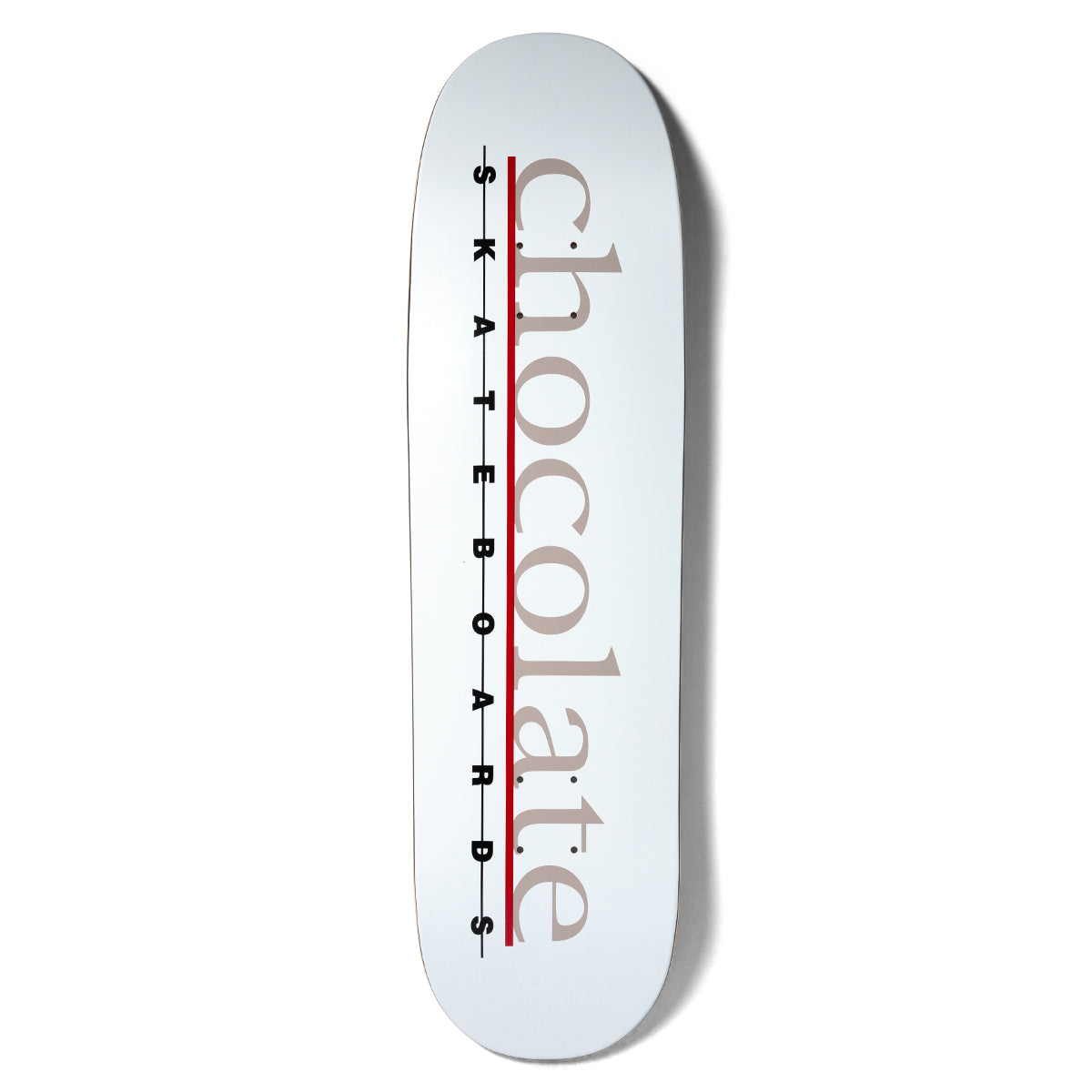 Chocolate Anderson Bar Logo Skidul skateboard deck: Large lower-case serif 'chocolate' in taupe runs along the deck over a red line, with 'S K A T E B O A R D S' in spaced black capitals on a white deck.