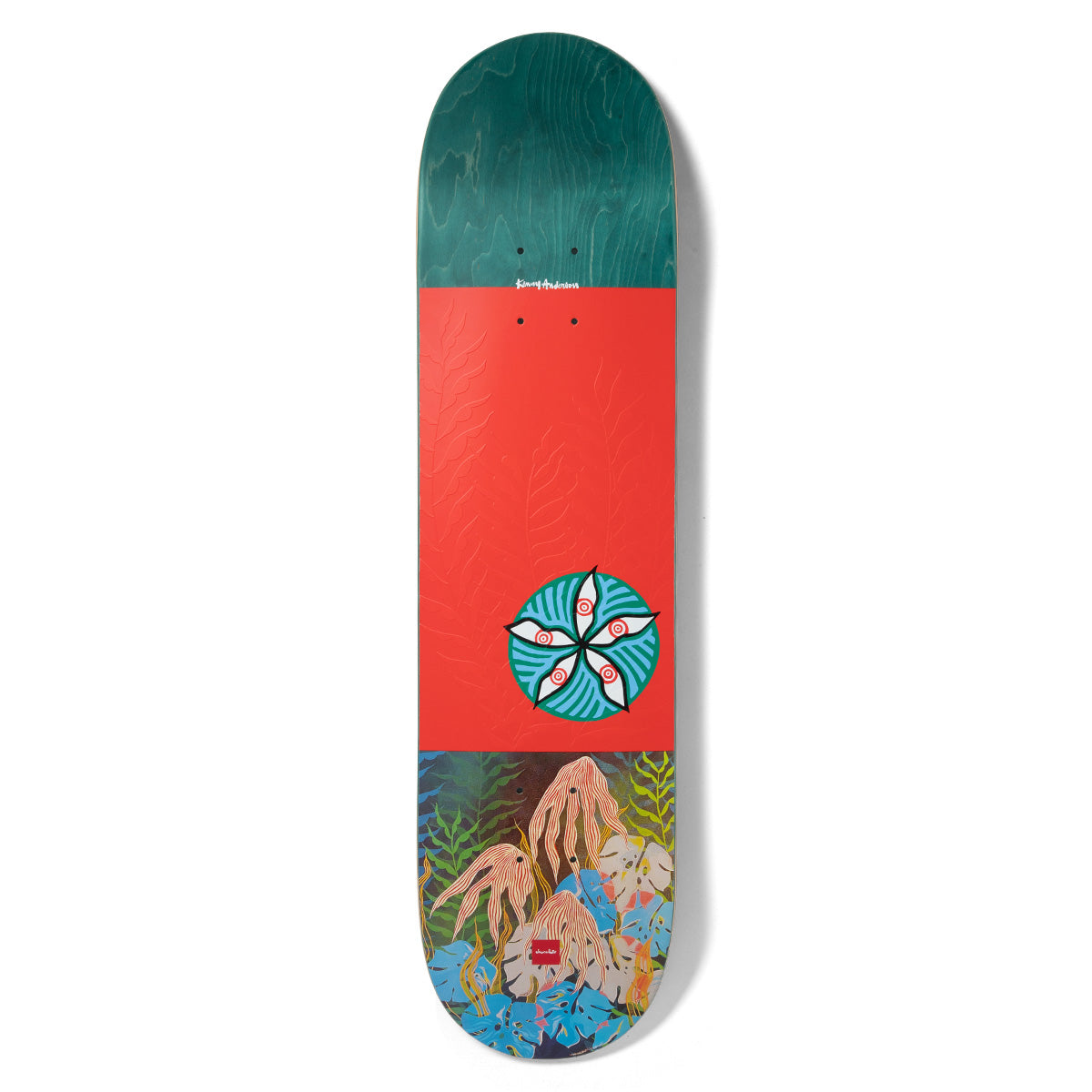 Chocolate Anderson Dog Perfume skateboard deck: Teal-stained top section, a red-orange middle with embossed fern pattern and a round teal medallion of five white eyes or petals. The base shows a painted jungle of leaves and tangled pink roots. Signature at the top and Chocolate logo at the bottom.