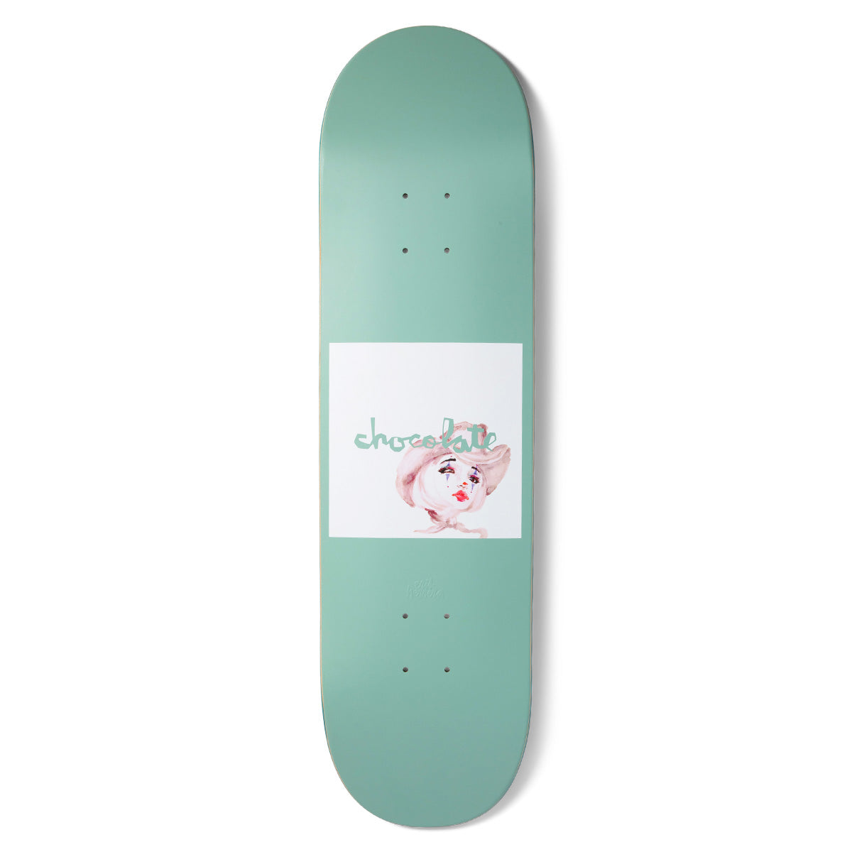 Chocolate Herrera Dream Rodeo skateboard deck: Pale green deck with a white square in the centre holding a soft watercolour of a face in a cowboy hat, with tears or make-up marks and red lips. The brand name is written in green script over it.