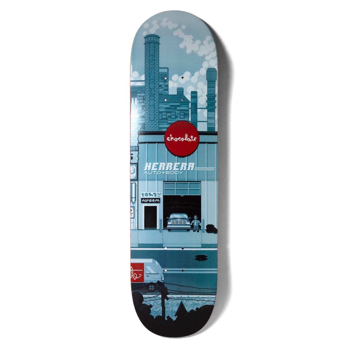 Chocolate Herrera Pixel City skateboard deck: Pixel-art city scene in blue-grey tones: factory chimneys with smoke above a garage front with a red Chocolate logo sign and Herrera Auto + Body lettering, a truck inside and a van on the street below.