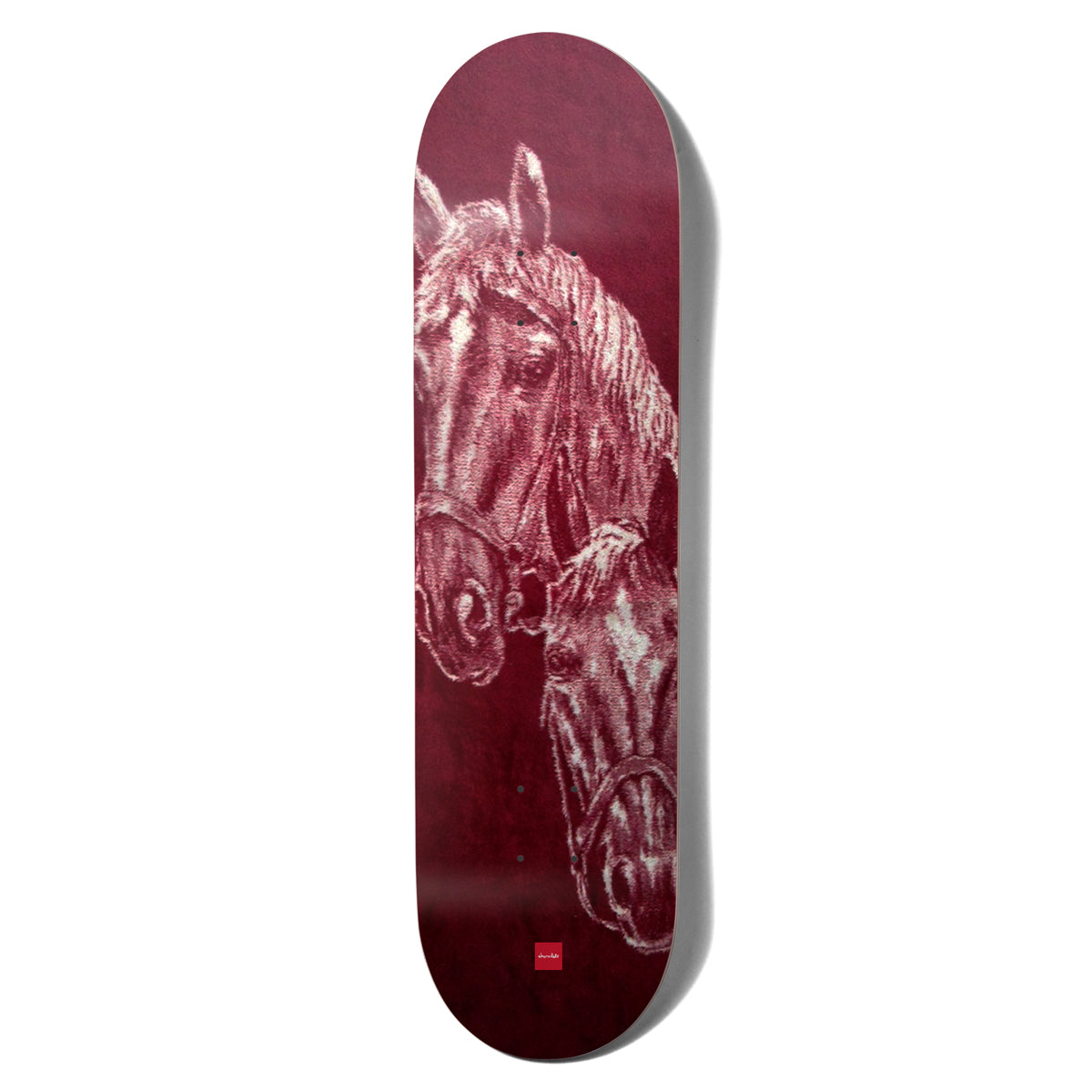 Chocolate Herrera San Choco skateboard deck: A textured, drawn or woven-looking portrait of two horses with halters, one in front of the other, in pale pink tones on a deep maroon deck. A small red Chocolate logo sits near the tail.