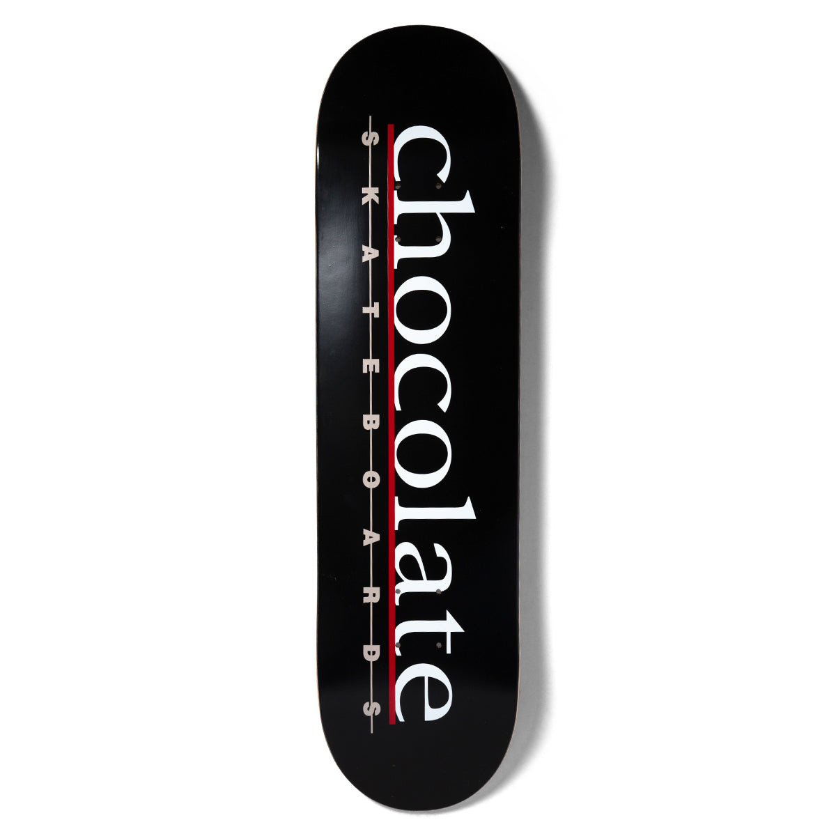 Chocolate Alvarez Bar Logo skateboard deck: Large white serif chocolate lettering running down a black deck, with spaced-out grey skateboards beneath it and a red rule line between.