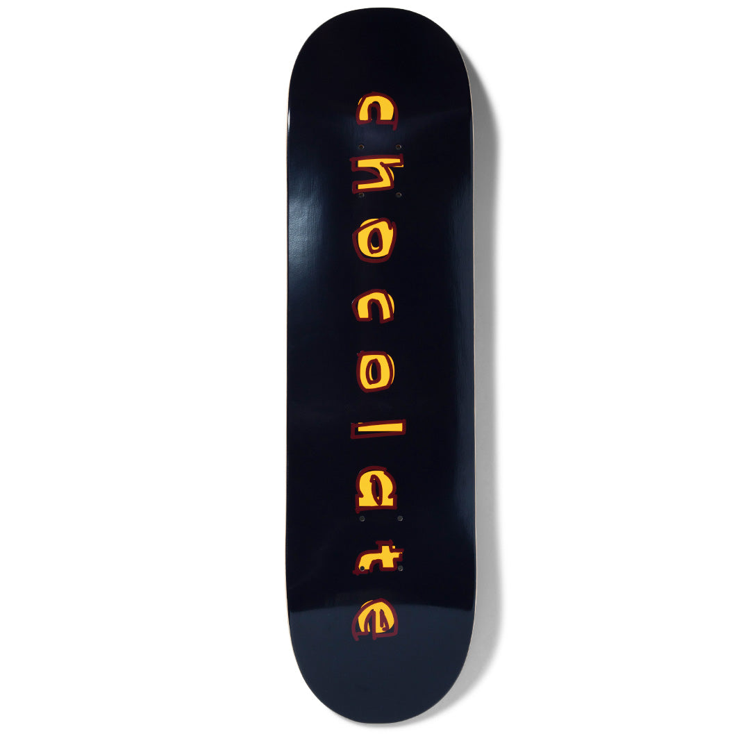 Chocolate Capps Comic skateboard deck: Glossy black deck with the word 'chocolate' stacked vertically down the centre in rough, hand-drawn lettering, filled yellow-orange with a dark red offset outline.