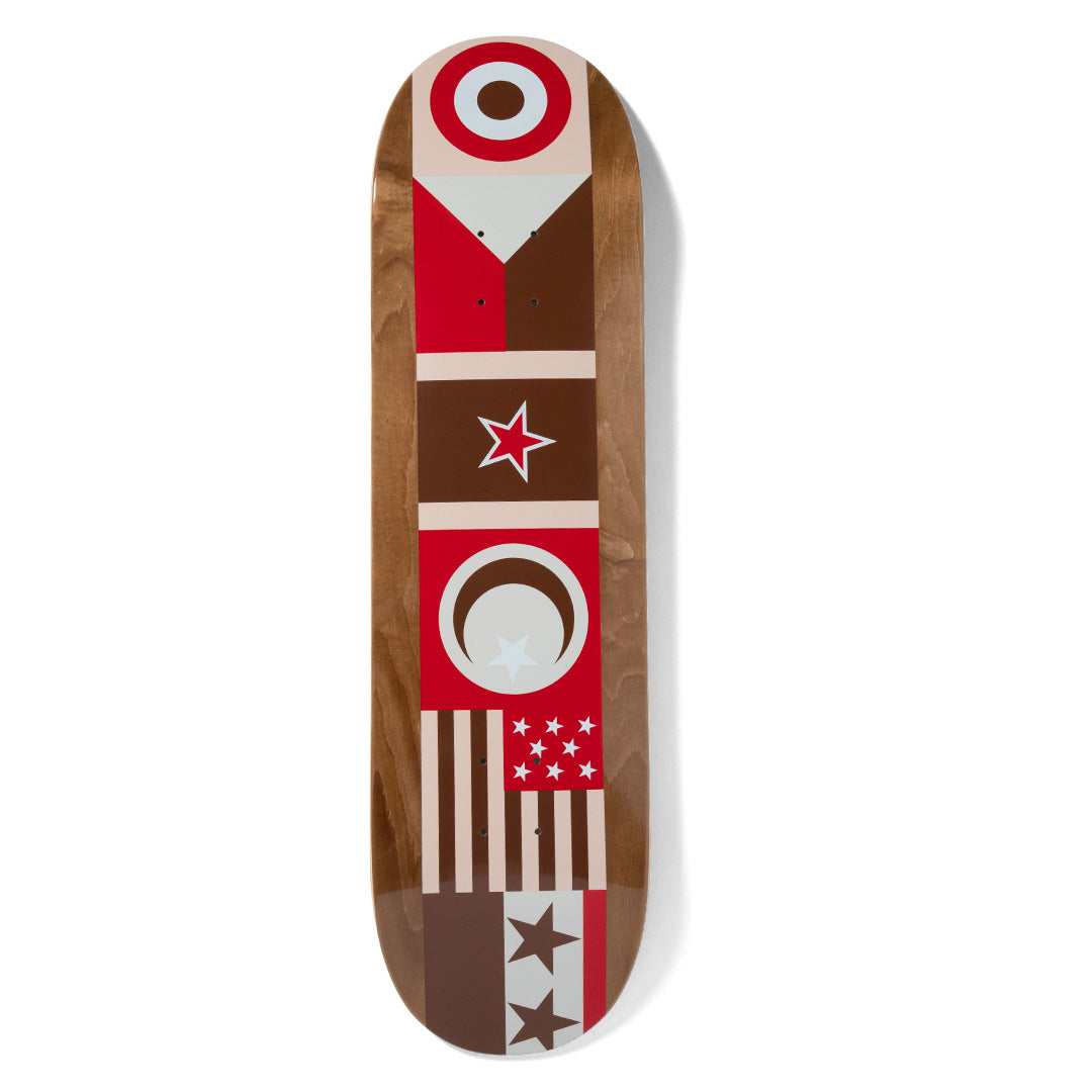 Chocolate Trahan Flags skateboard deck: Stacked geometric flag-style panels in red, cream and brown: a target roundel, a star, a crescent and star, and stripes with stars, printed over a stained brown wood veneer.