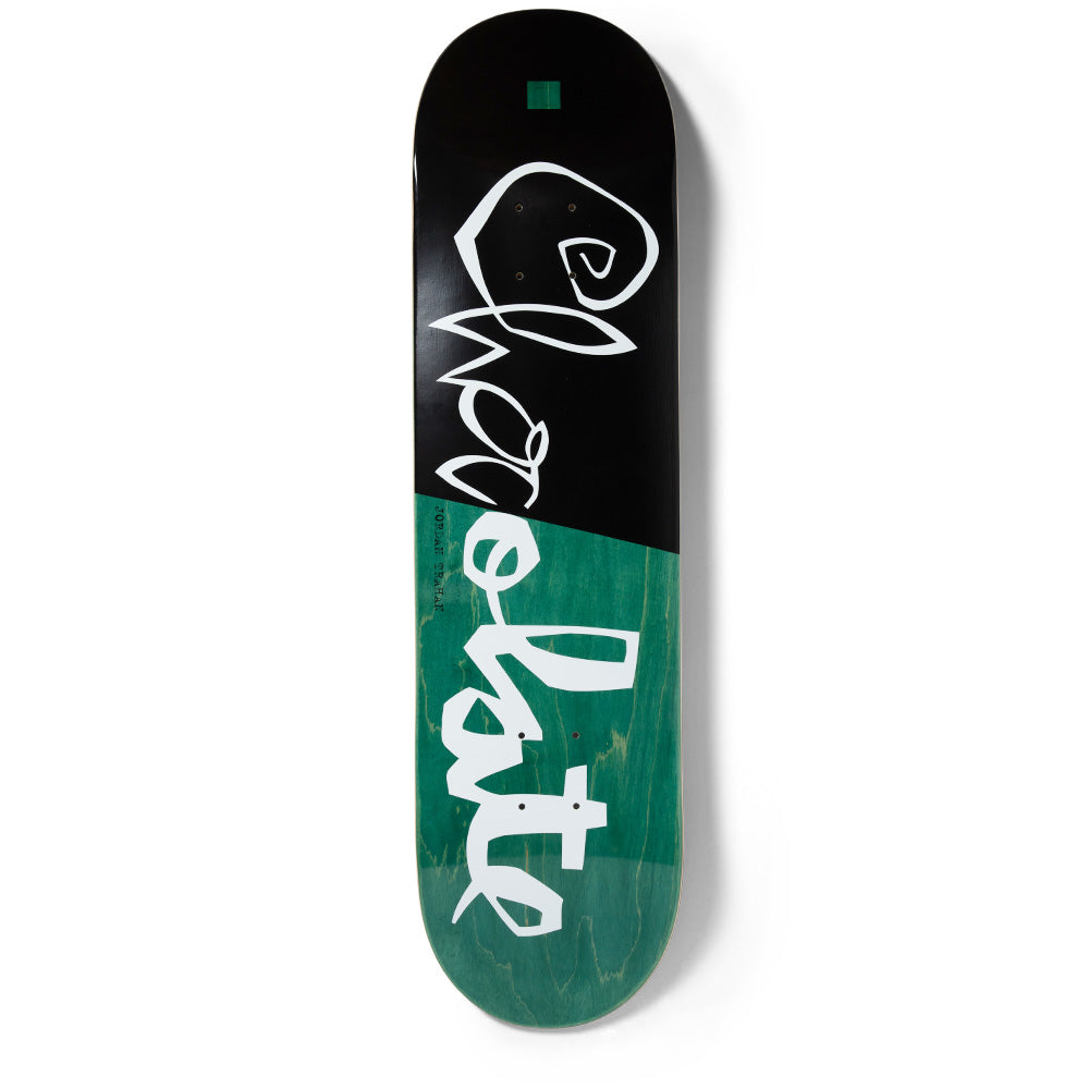 Chocolate Trahan Scrunk skateboard deck: Loose hand-drawn white Chocolate lettering running down the deck, which is split diagonally between a black top half and a teal wood-stained lower half, with a small green square near the nose.