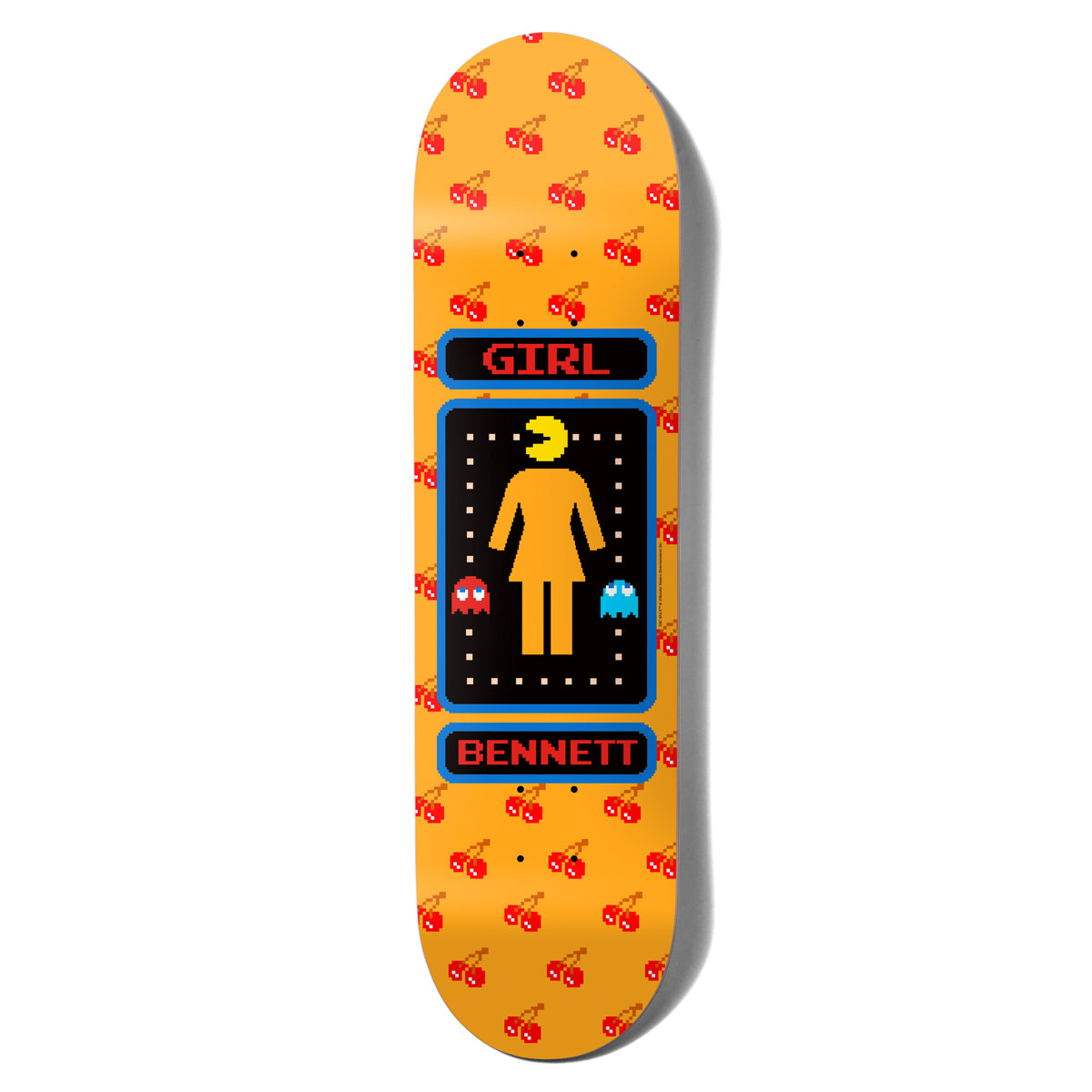 Girl Bennett Pac - Man skateboard deck: The Girl logo figure with a Pac-Man head sits inside an arcade-maze panel with two ghosts, framed in blue with 'Girl' and 'Bennett' labels, over an orange board patterned with pixel cherries.